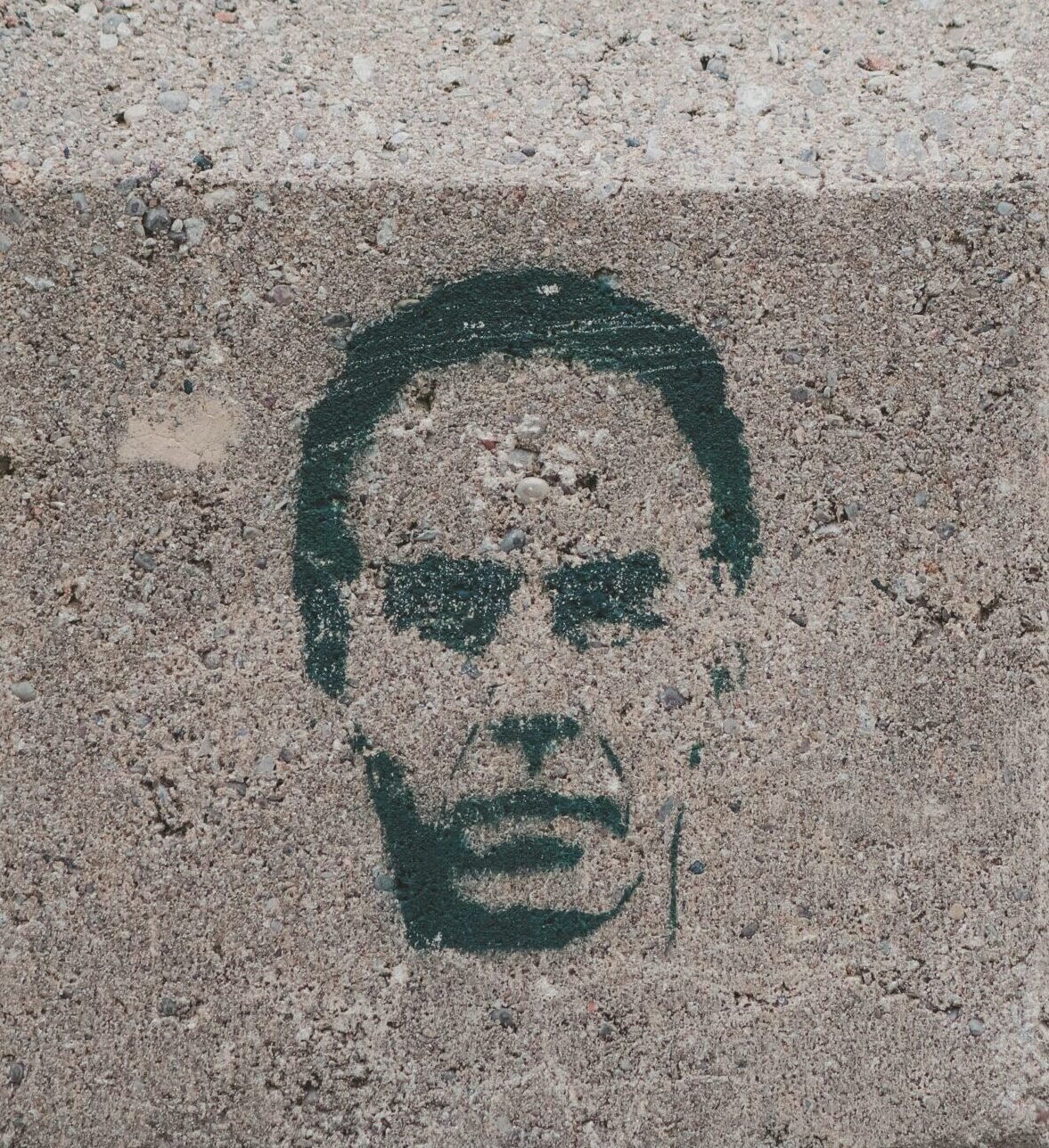 a cement block with a picture of a man on it